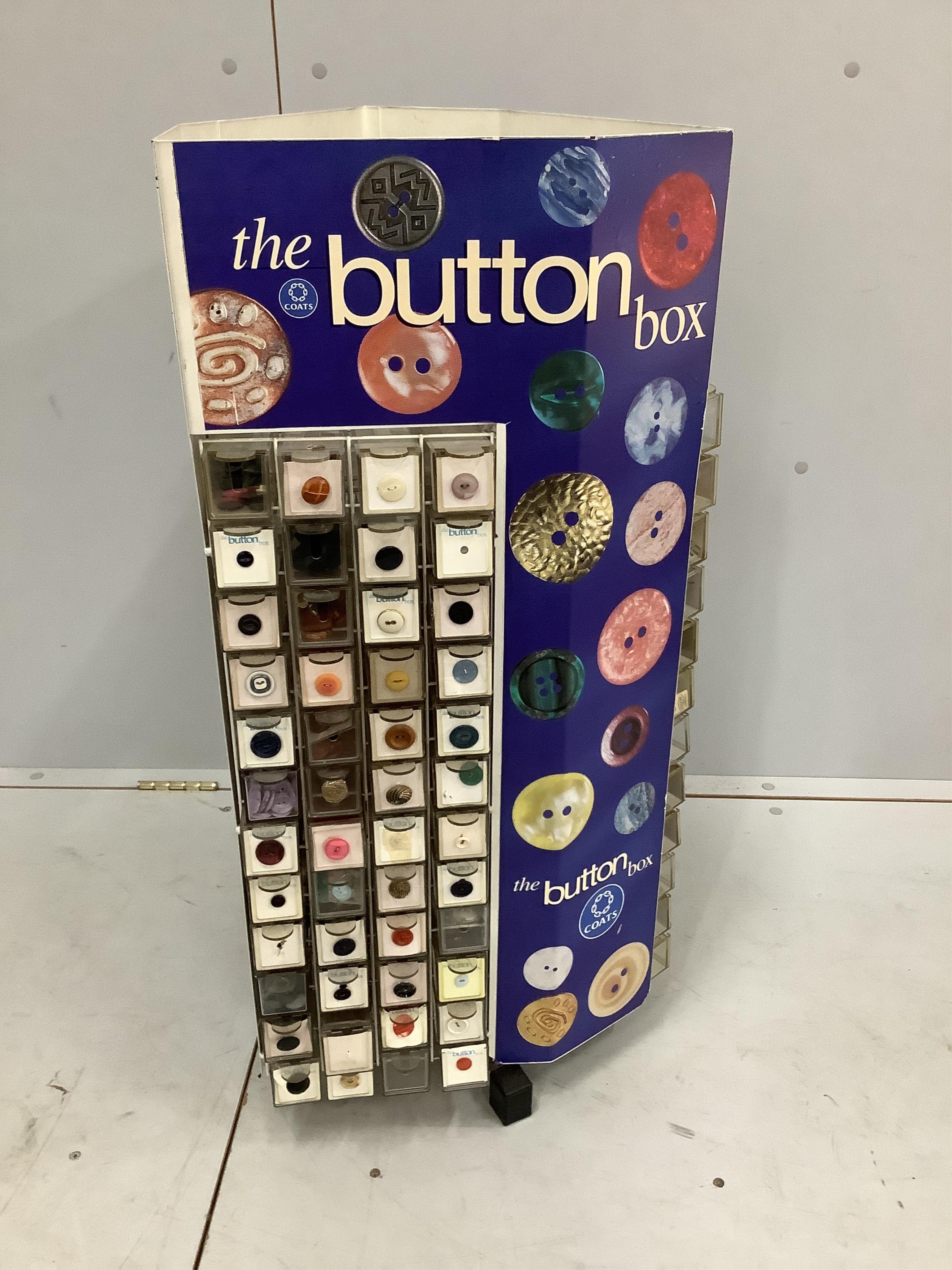 A Coats 'button box’ haberdasher's button display carousel, with a quantity of assorted buttons, width 39cm, height 86cm. Condition - fair